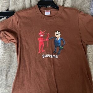 Supreme Brown Tee with Red Devil & Blue Businessman Graphic